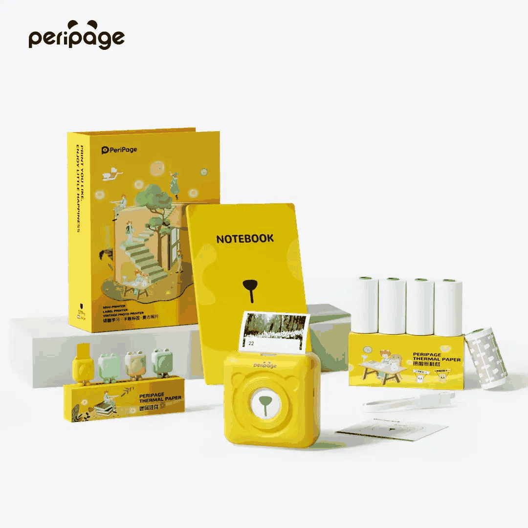 PeriPage 2" A6 Mini Printer gift box with yellow compact printer, thermal paper rolls, notebook, stickers, and accessories.